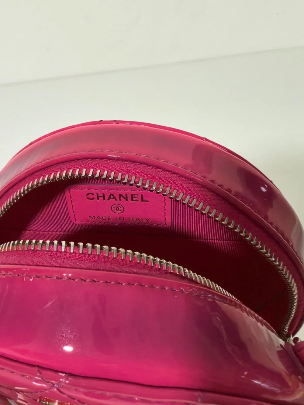 CHANEL Hot Pink Quilted Patent Leather Round Crossbody with Gold CC